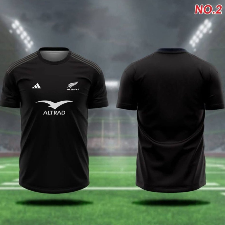 Black sports jersey with visible branding on a grass field background